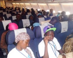 Participants in a plane traveling for a training